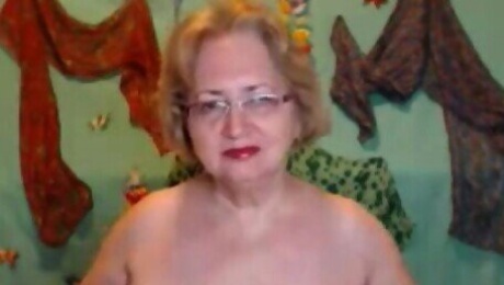 Charismatic blonde granny undressing for us on