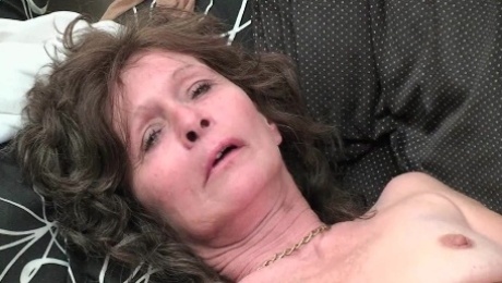 Granny with saggy tits and hairy pussy masturbates