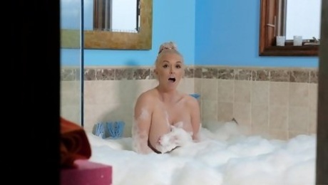 Busty woman appears sucking and fucking in the soapy tub